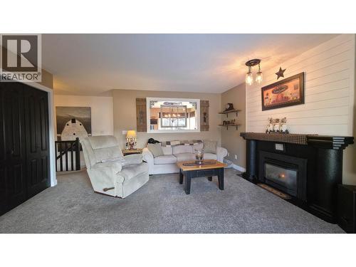 6958 St Anthony Crescent, Prince George, BC - Indoor Photo Showing Living Room With Fireplace