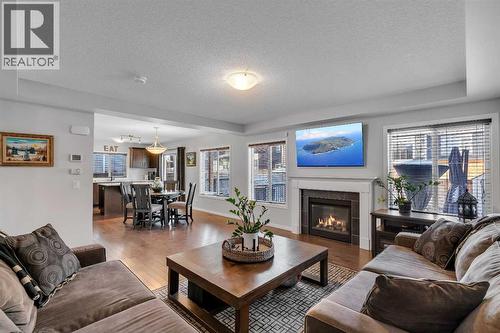 136 Viewpointe Terrace, Chestermere, AB - Indoor Photo Showing Living Room With Fireplace
