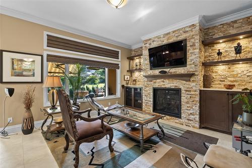 3992 Gallaghers Parkway, Kelowna, BC - Indoor Photo Showing Other Room With Fireplace
