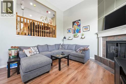 23, 1225 Railway Avenue, Canmore, AB - Indoor Photo Showing Living Room With Fireplace