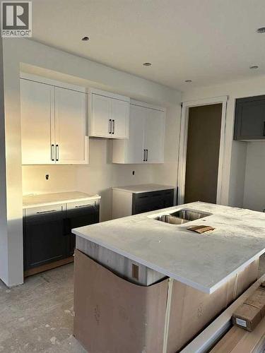 277 Waterford Way, Chestermere, AB - Indoor Photo Showing Kitchen With Double Sink