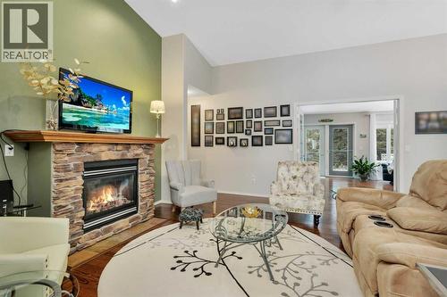 605 5 Street Sw, Sundre, AB - Indoor Photo Showing Living Room With Fireplace