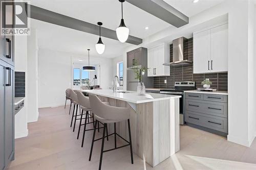 299 Waterford Heights, Chestermere, AB - Indoor Photo Showing Kitchen With Upgraded Kitchen