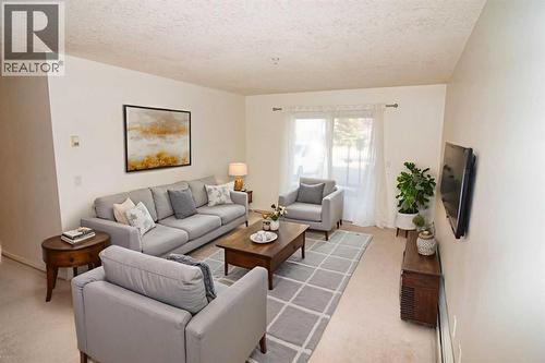 2106, 20 Harvest Rose Park Ne, Calgary, AB - Indoor Photo Showing Living Room