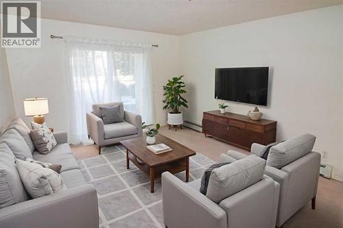 2106, 20 Harvest Rose Park Ne, Calgary, AB - Indoor Photo Showing Living Room