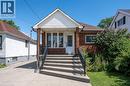 Bungalow featuring brick siding, a porch, and a shingled roof - 525 Britannia Avenue, Hamilton, ON  - Outdoor 