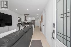 Living area featuring recessed lighting and light wood-type flooring - 