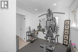 Exercise area featuring recessed lighting and baseboards - 