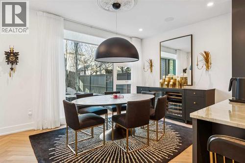 DINING AREA HAS BUILT-IN STORAGE UNIT WITH 2 SUB-ZERO WINE FRIDGES - 3813 1A Street Sw, Calgary, AB - Indoor Photo Showing Dining Room
