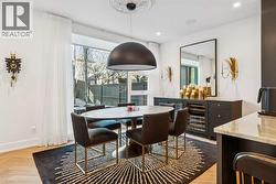 DINING AREA HAS BUILT-IN STORAGE UNIT WITH 2 SUB-ZERO WINE FRIDGES - 