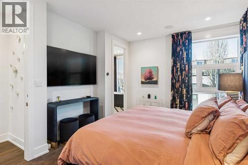 WALL-MOUNTED TV INCLUDED - 3813 1A Street Sw, Calgary, AB - Indoor Photo Showing Bedroom
