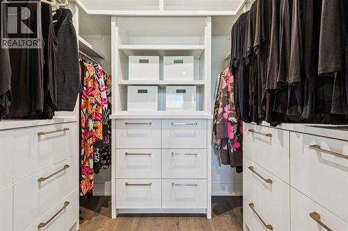 WALK-IN CLOSET WITH BUILT-INS - 3813 1A Street Sw, Calgary, AB - Indoor With Storage