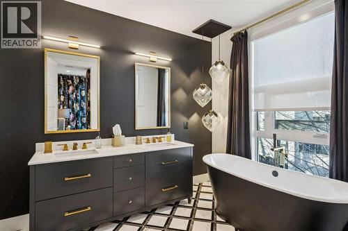 CUSTOM HEATED MARBLE FLOORS. DESIGNER LIGHTING - 3813 1A Street Sw, Calgary, AB - Indoor Photo Showing Bathroom