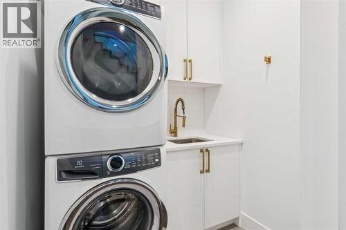 WALK-IN LAUNDRY ROOM WITH SINK AND STORAGE - 3813 1A Street Sw, Calgary, AB - Indoor Photo Showing Laundry Room