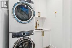 WALK-IN LAUNDRY ROOM WITH SINK AND STORAGE - 