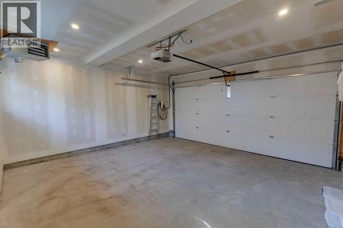 HEATED AND FINISHED DOUBLE GARAGE WITH 2 EV CHARGERS - 3813 1A Street Sw, Calgary, AB - Indoor Photo Showing Garage