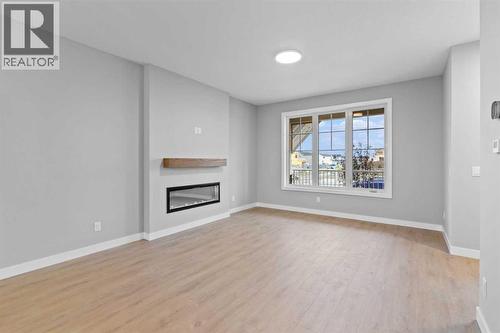 191 Belvedere Crescent Se, Calgary, AB - Indoor Photo Showing Living Room With Fireplace