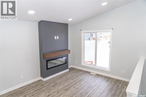 366 Stehwien Street, Saskatoon, SK - Indoor Photo Showing Other Room With Fireplace