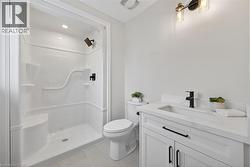Ensuite bathroom, with  shower surround and quartz counters. - 