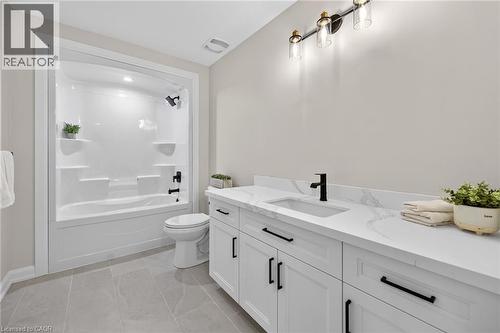Main Bathroom with tub surround and quartz counters - 45B Howard Street, Hagersville, ON - Indoor Photo Showing Bathroom