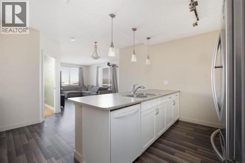 504, 136A Sandpiper Road, Fort Mcmurray, AB - Indoor Photo Showing Kitchen With Double Sink With Upgraded Kitchen
