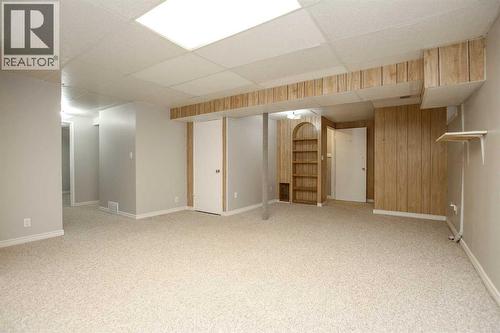 Family Room with Built In's and Storage - 69 Erickson Drive, Red Deer, AB - Indoor Photo Showing Basement