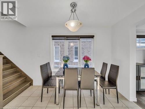 Dining room with light tile patterned floors and stairway - 144 Summit Ridge Drive, Guelph, ON - Indoor Photo Showing Dining Room