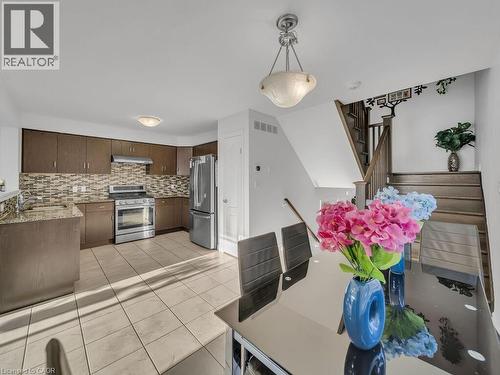 Dining area with light tile patterned flooring - 144 Summit Ridge Drive, Guelph, ON - Indoor