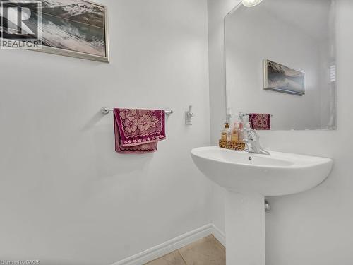 Bathroom featuring baseboards and light tile patterned floors - 144 Summit Ridge Drive, Guelph, ON - Indoor Photo Showing Bathroom