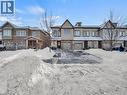 View of front of house with an attached garage and brick siding - 144 Summit Ridge Drive, Guelph, ON  - Outdoor With Facade 