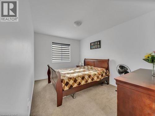 Bedroom with light carpet - 144 Summit Ridge Drive, Guelph, ON - Indoor Photo Showing Bedroom