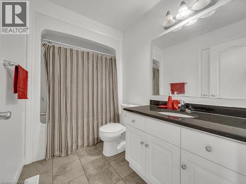 Full bathroom featuring vanity and shower / tub combo with curtain - 144 Summit Ridge Drive, Guelph, ON - Indoor Photo Showing Bathroom