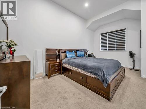 Bedroom featuring light colored carpet and lofted ceiling - 144 Summit Ridge Drive, Guelph, ON - Indoor Photo Showing Bedroom
