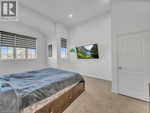 Bedroom featuring light colored carpet and recessed lighting - 144 Summit Ridge Drive, Guelph, ON - Indoor Photo Showing Bedroom