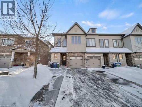 View of front facade featuring a garage - 144 Summit Ridge Drive, Guelph, ON - Outdoor With Facade