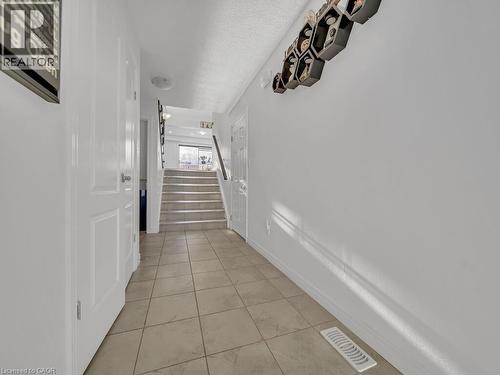 Corridor featuring stairway and light tile patterned floors - 144 Summit Ridge Drive, Guelph, ON - Indoor Photo Showing Other Room