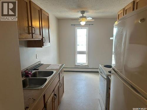 201 3094 5Th Avenue E, Prince Albert, SK - Indoor Photo Showing Kitchen With Double Sink