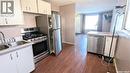 147 Ross Crescent, Saskatoon, SK  - Indoor Photo Showing Kitchen With Double Sink 