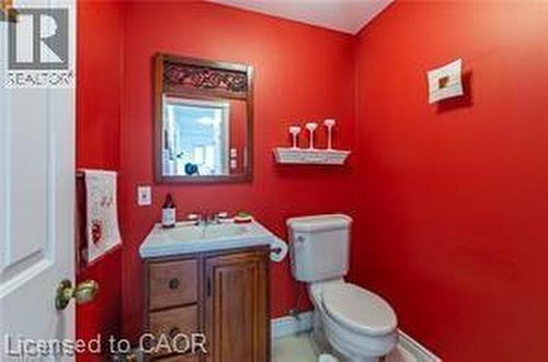 Half bathroom featuring vanity and toilet - 158 River Run Road, Drayton, ON - Indoor Photo Showing Bathroom