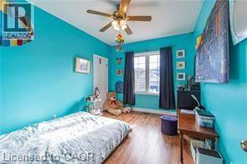 Bedroom with wood finished floors and ceiling fan - 158 River Run Road, Drayton, ON - Indoor Photo Showing Bedroom