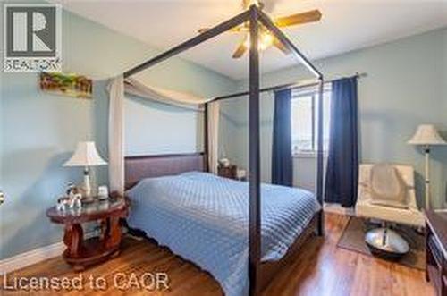 Bedroom featuring wood finished floors and ceiling fan - 158 River Run Road, Drayton, ON - Indoor Photo Showing Bedroom