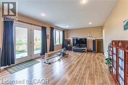 Workout area with wood finished floors and recessed lighting - 158 River Run Road, Drayton, ON - Indoor