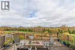 Wooden terrace featuring an outdoor hangout area - 