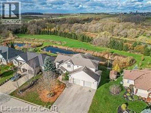 Aerial perspective of suburban area featuring a nearby body of water - 158 River Run Road, Drayton, ON - Outdoor With View
