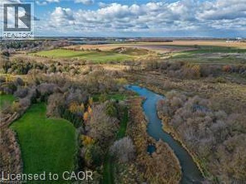 Aerial view of property and surrounding area with a large body of water and rural landscape - 158 River Run Road, Drayton, ON - Outdoor With View