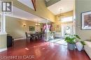 Entryway featuring dark wood-style floors, a chandelier, and decorative columns - 158 River Run Road, Drayton, ON  - Indoor 