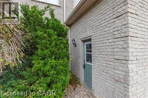 View of side of property featuring brick siding - 158 River Run Road, Drayton, ON - Outdoor