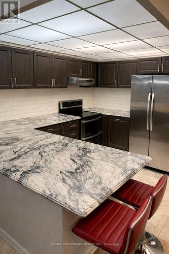 209 - 8 Silverbelle Grove, Toronto, ON - Indoor Photo Showing Kitchen With Upgraded Kitchen