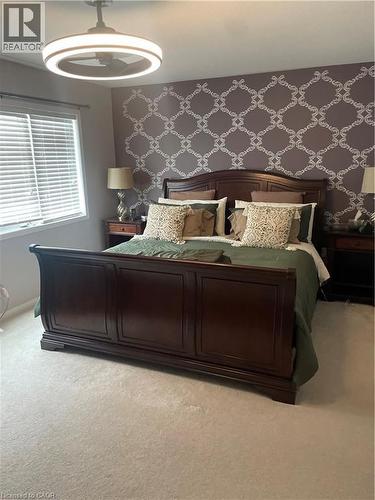 Bedroom with light carpet and a ceiling fan - 229 Pine Glen Crescent, Kitchener, ON - Indoor Photo Showing Bedroom