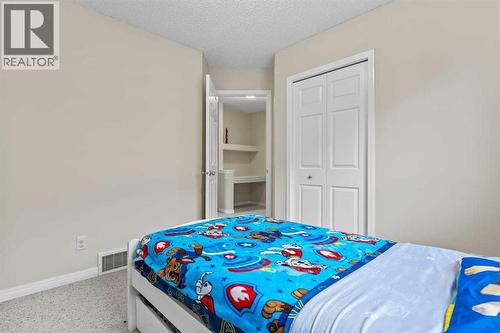176 Cougar Ridge Circle Sw, Calgary, AB - Indoor Photo Showing Bedroom